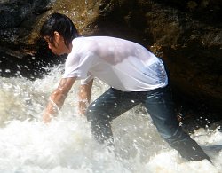 waterfall wet jeans and t-shirt